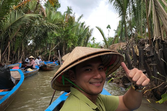 Cu Chi Tunnels and Mekong Delta Full Day Tour - Max 12 - A coconut village ride that breaks up the heat