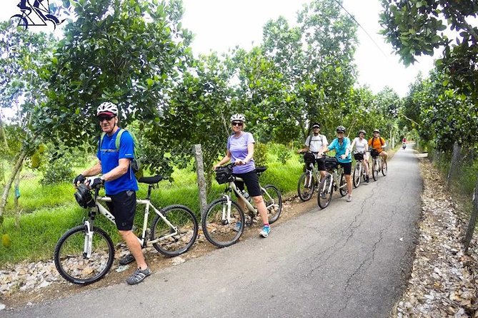 Cu Chi Tunnels - Cao Dai Temple & Black Virgin Mountain Full Day - The Mekong Delta-style village time: fruit, music, biking, and a boat ride