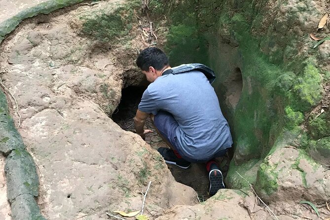Cu Chi Tunnels tour In The Morning by DGT - The tunnel crawl: small openings, careful footing, and how to do it well