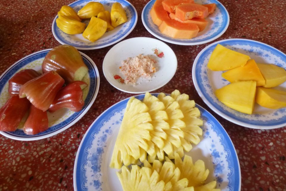 From Ho Chi Minh City: Mekong Delta VIP Tour by Limousine - Coconut Island and the village walk: fruit, honey, music, and coconut candy