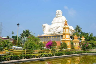 From Ho Chi Minh: Mekong Delta Small Group Day Trip - Morning at Vinh Trang Pagoda: ornate, photogenic, and dress-code serious