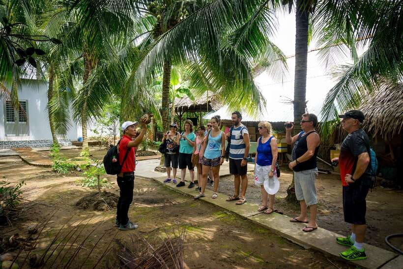 From Ho Chi Minh: Mekong Delta Small Group Day Trip - Lunch in an orchard garden: coconut candy training wheels for your suitcase