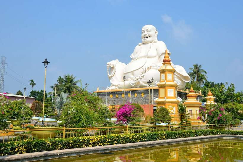 From Ho Chi Minh: Mekong Delta Small Group Day Trip - Morning at Vinh Trang Pagoda: ornate, photogenic, and dress-code serious