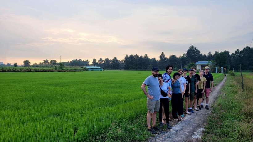 Ho Chi Minh City: 2-Day Bike & Kayak Mekong Delta Tour - Day 1: cooking class, Vinh Trang Pagoda, canal boats, honey tea, and coconut candy