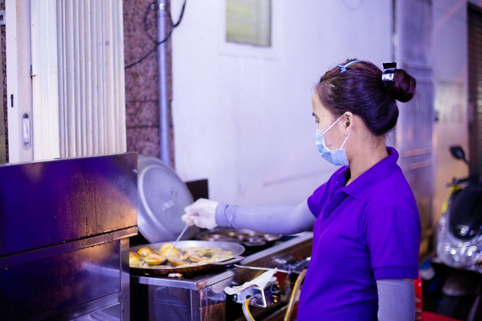 Ho Chi Minh City: Private Street Food Motorbike Tour - District 5 coconut ice cream prep plus narrow alleys and Saigon River breeze