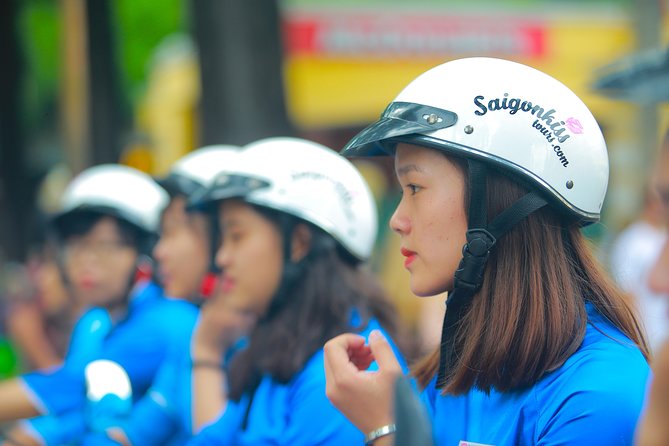 Ho Chi Minh Night Tour by Motorbikes with Female Rider | KissTour - Riding pillion: helmets, rain ponchos, and how to feel steady