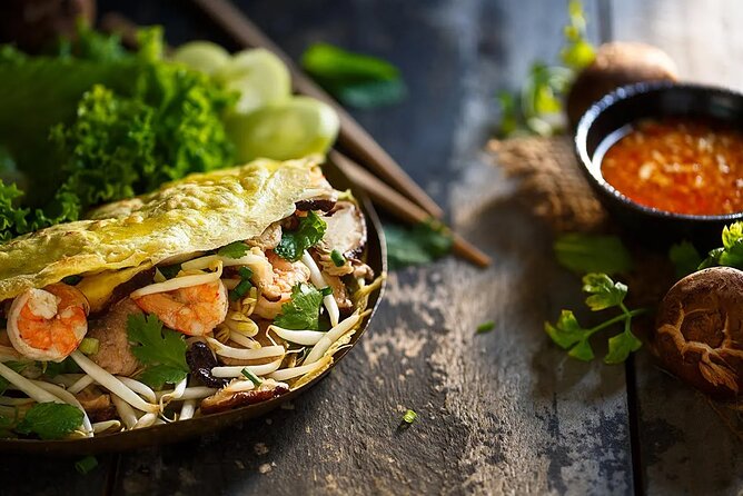 Private Jeep Tour Saigon by Night: Foodie & City Tour - Foodie setup: dinner at two restaurants plus a skybar drink
