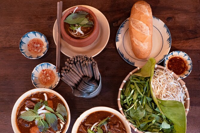 Private Street Food Motorbike Tour in Ho Chi Minh City - Stop One: Street Food Man and the Night Ride Through District 3