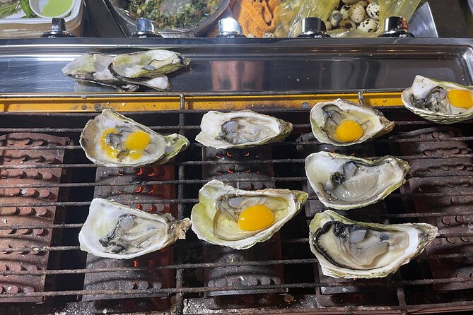 Saigon By Night and Street Food By Motorbike | Opt: Ao Dai Riders - Your night route: food stops from noodles to oysters to spring roll vermicelli