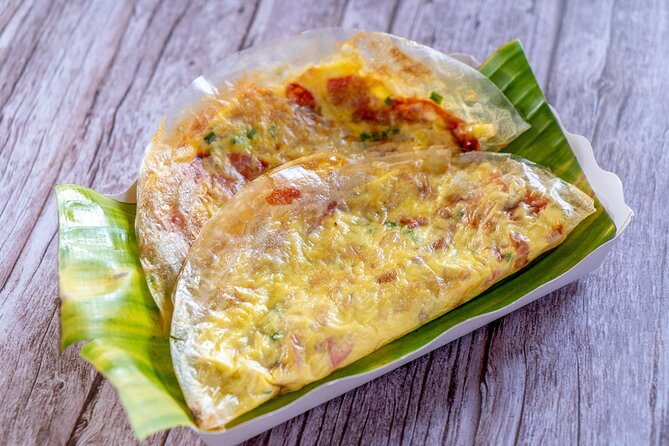 Saigon By Night and Vietnam Local Food on Motorbike - Ho Thi Ky Flower Market (District 10) and grilled rice-paper pizza