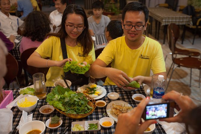 Saigon Night Street Food and City Tour on Scooter - Guide team and small-group pacing
