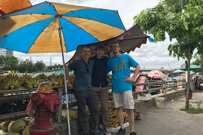 Saigon Slum tour and Saigon Chillspots by motorbike/ Aodai rider - A scooter tour that swaps landmarks for real streets